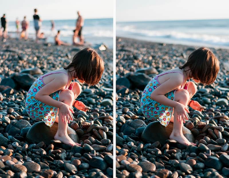 A little girl on a serene beach after people in the distant background were removed.